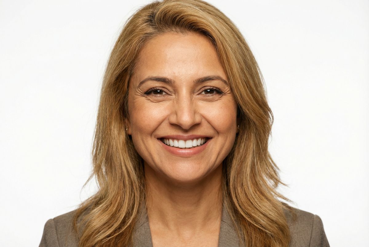 Person smiling confidently after veneer treatment