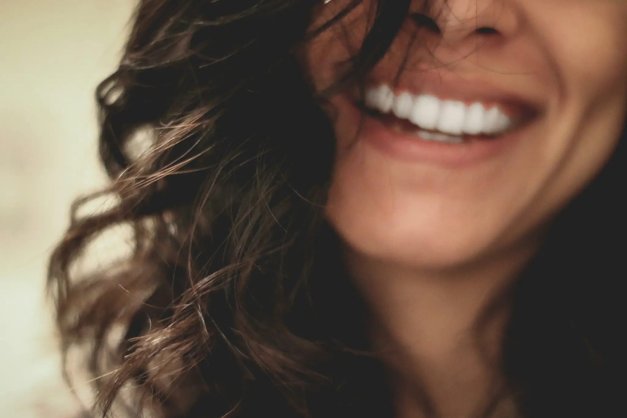 Woman with a confident, natural-looking smile after veneers